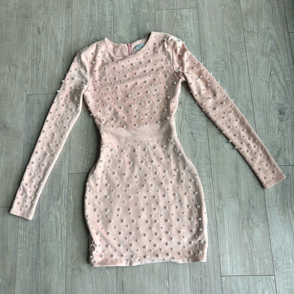 Mauve pink super soft fabric that looks like suede adorned with pearl beads
